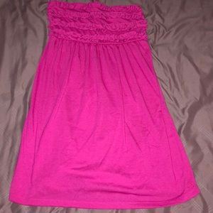 Pink bathing suit coverup.